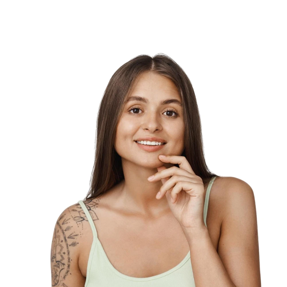 Smiling woman with tattoo sleeve showing results of pico laser vs Q-switched laser treatment